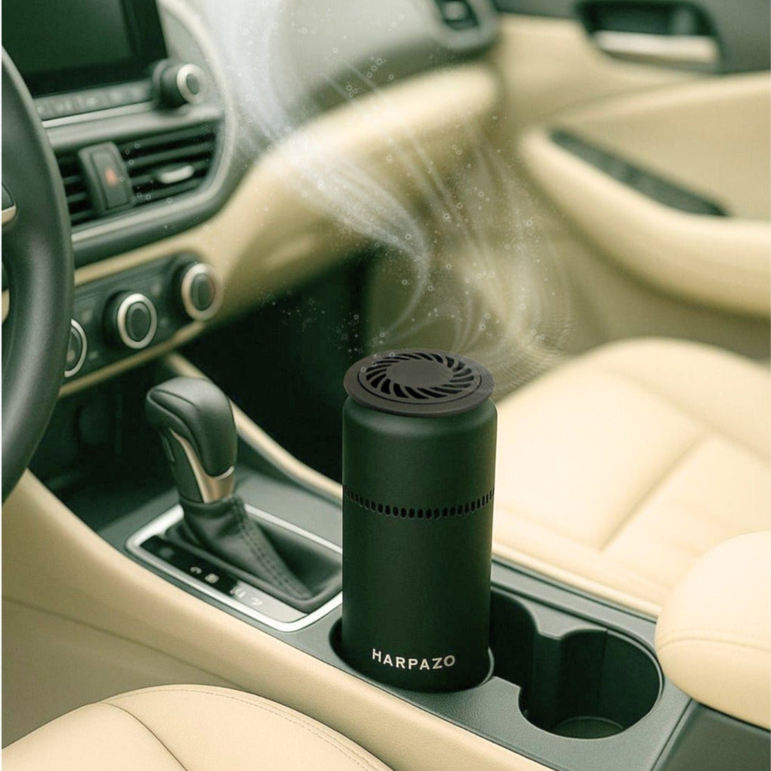 Car interior with a black car air freshener diffusing fragrance