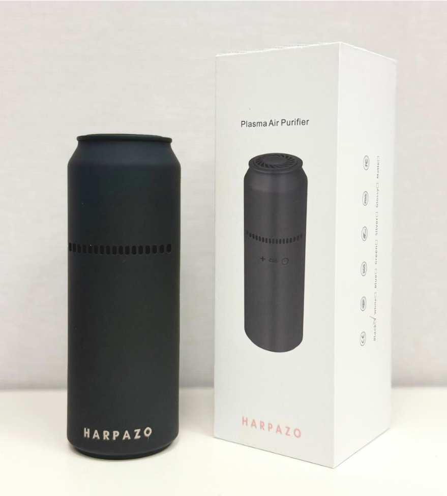 Black air purifier with 'Harpazo' branding next to its packaging on a white background