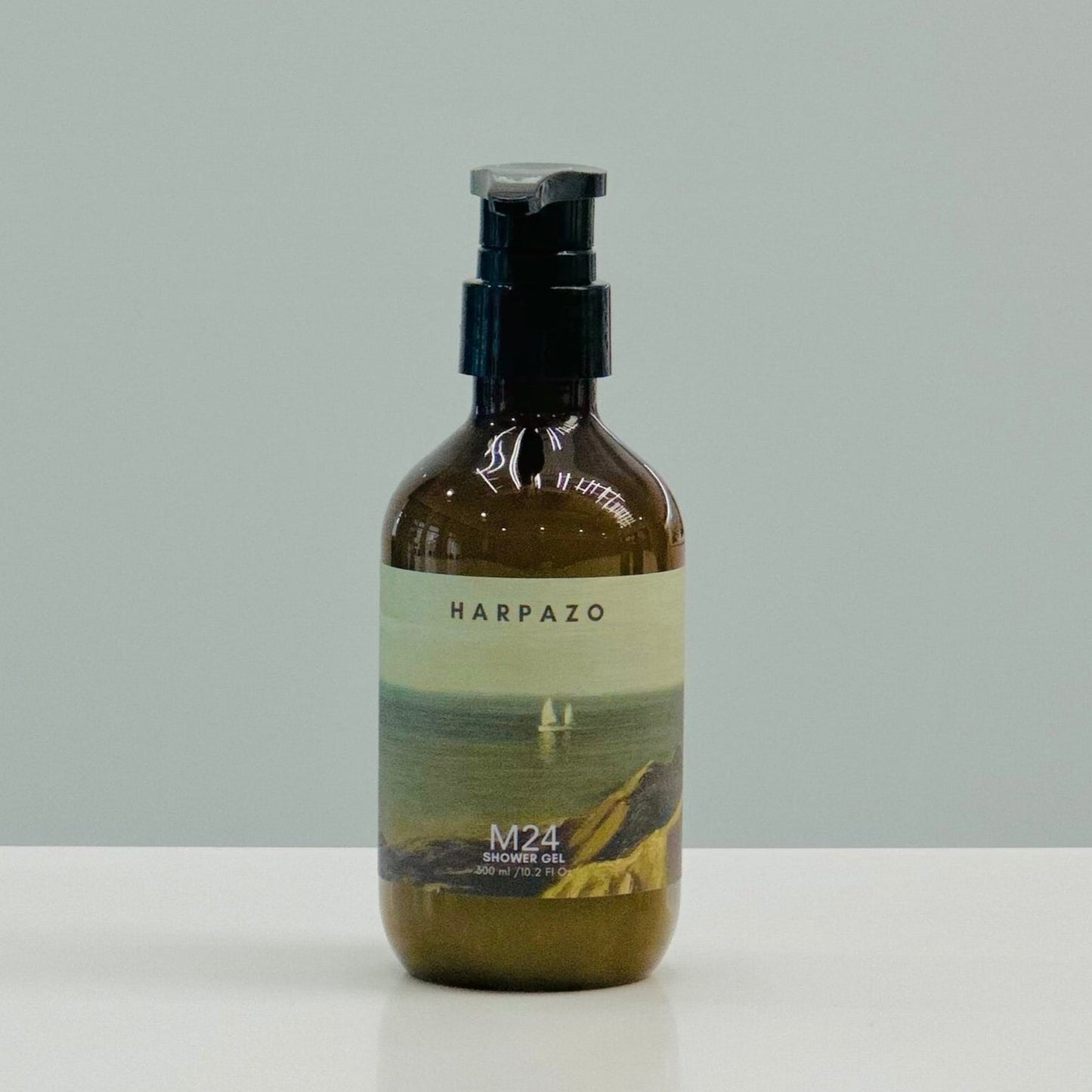 A pump bottle of M24 Longjing Tea shower gel with jasmine and sandalwood, standing against a plain background.