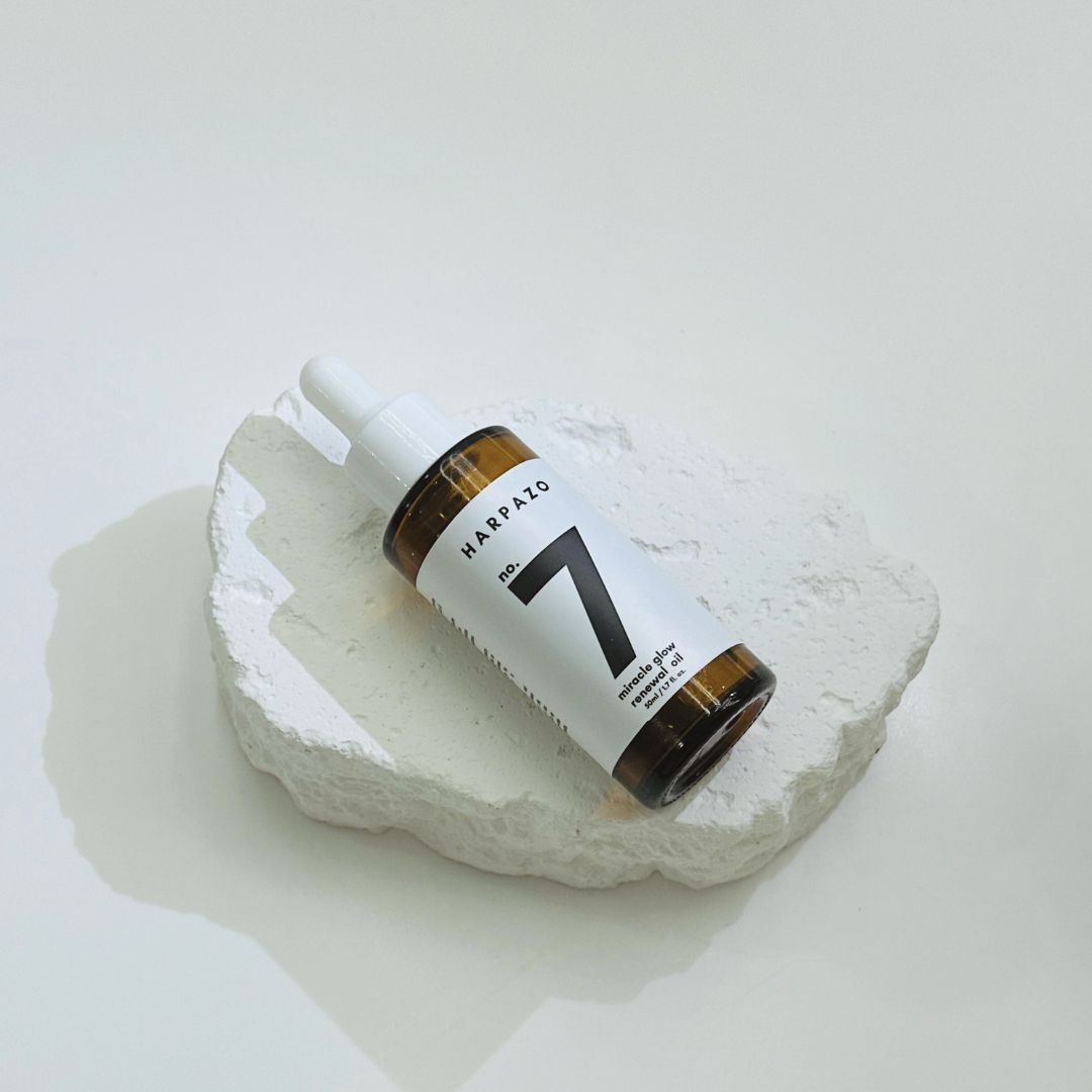 Bottle labeled 'Harpazo No. 7' on a white stone surface