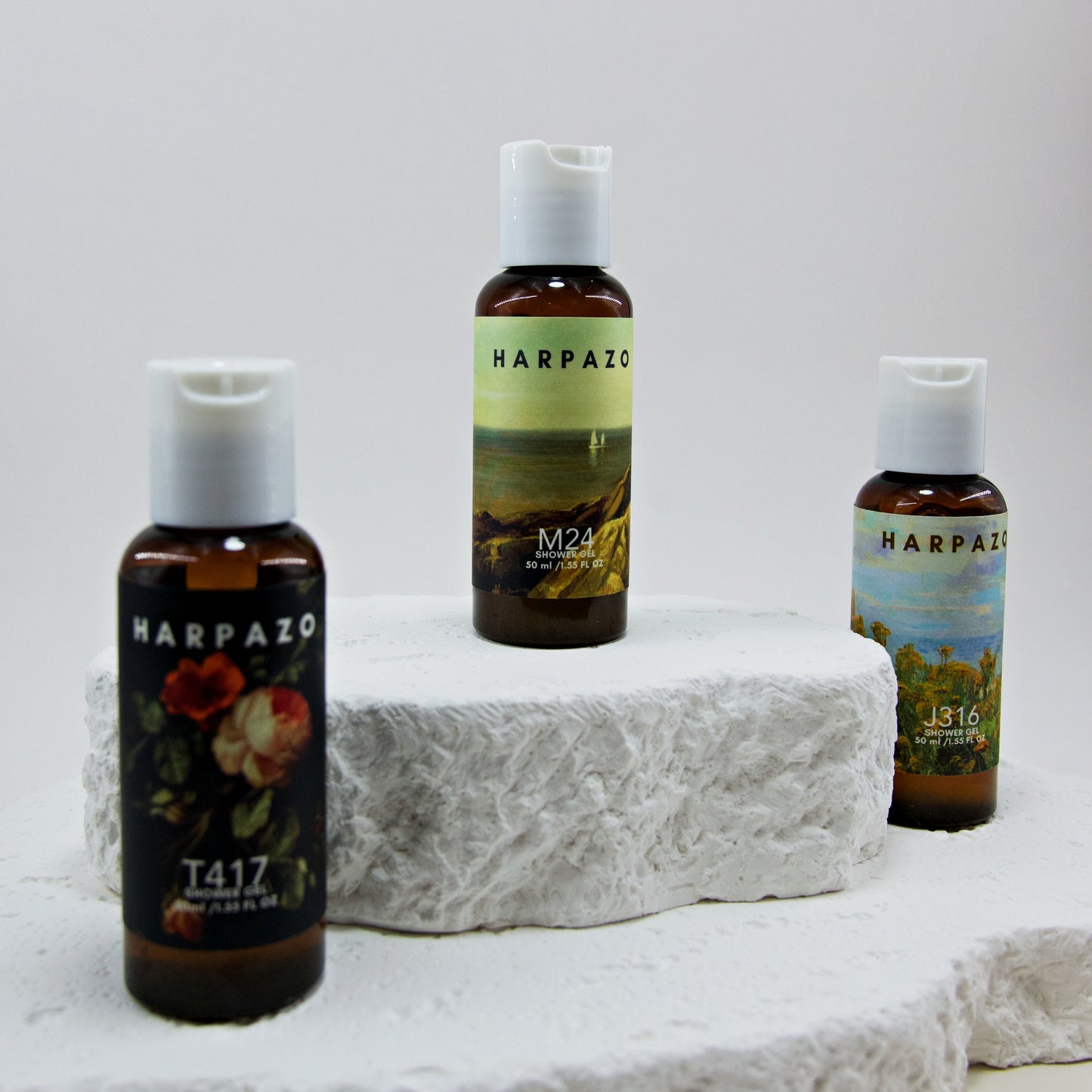 Three bottles of Harpazo skincare products on a white stone surface with a light gray background.