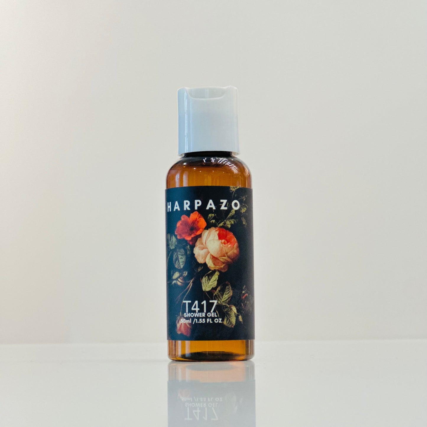 Harpazo T417 toner oil bottle with floral design on a light gray background