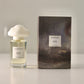 Perfume bottle and packaging with 'Narfazo' branding on a neutral background