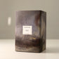 Dark textured box with a label on a light background