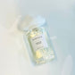 Perfume bottle with a label on a light background