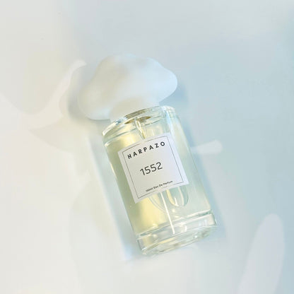 Perfume bottle with a label on a light background