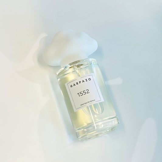 Perfume bottle with a label on a light background