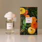 Harpazo 1552 perfume bottle and packaging with floral design on a neutral background