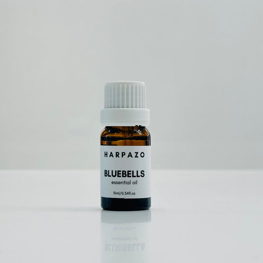 A small bottle labeled 'BLUEBELLS essential oil 10ml' with a white cap, displayed against a white background.
