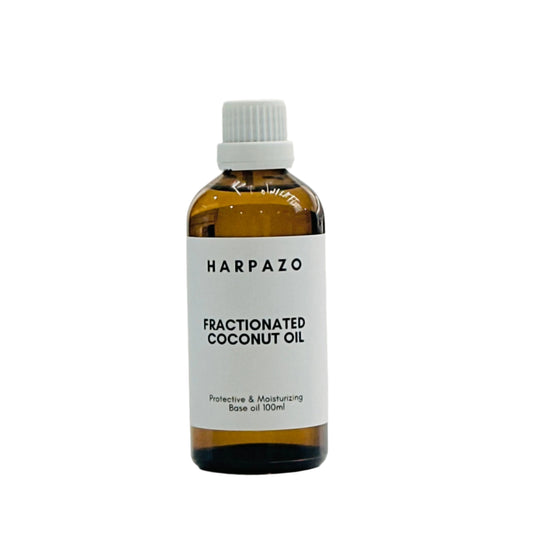 A bottle of HARPAZO Fractionated Coconut Oil, 100ml, with a white cap and label.