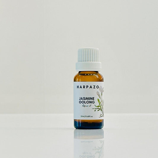 A bottle of HARPAZO Jasmine Oolong Diffuser Oil with a white cap, placed against a white background.