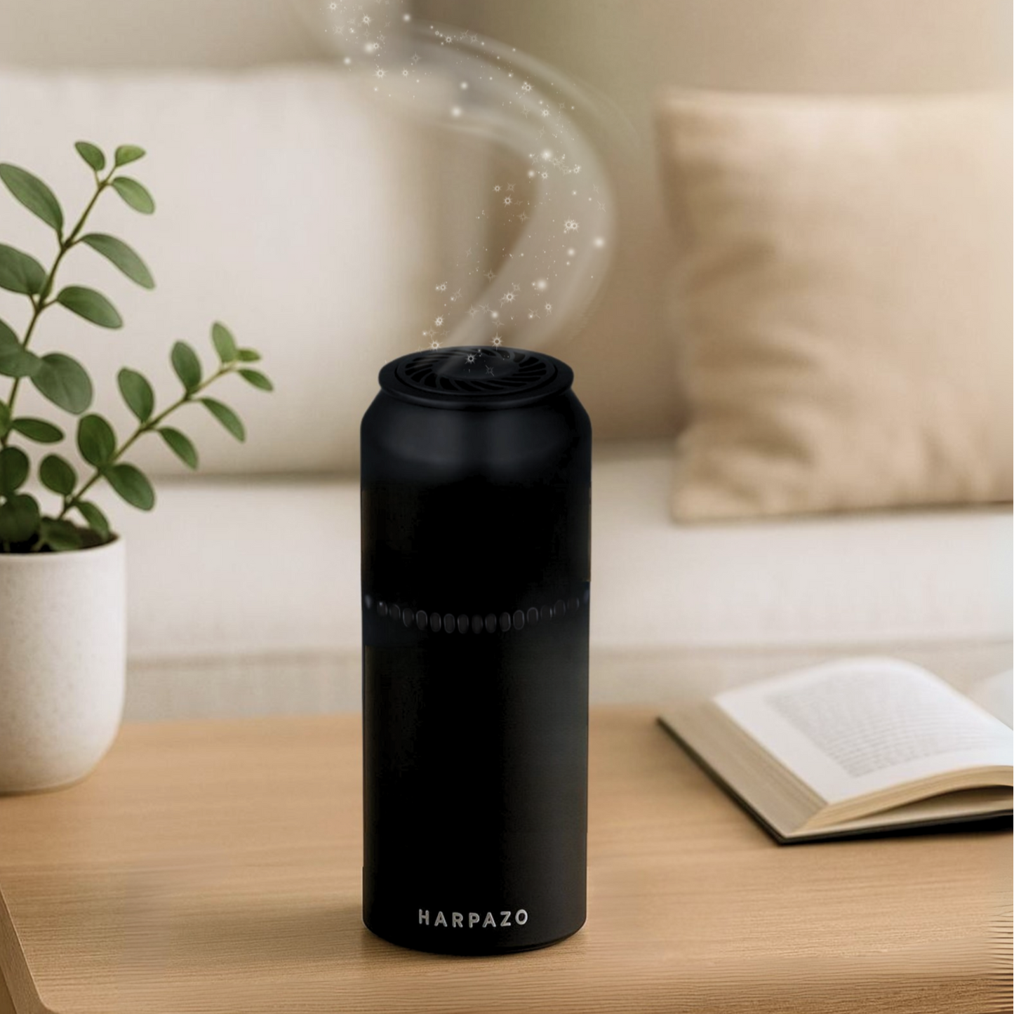 Black humidifier labeled 'HARPAZO' on a wooden table with a plant and book in the background