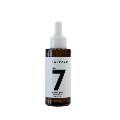Bottle of Harpazo no. 7 miracle glow renewal oil on a white background