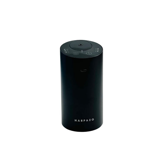 A black cylindrical waterless fragrance oil diffuser with control buttons on the top.