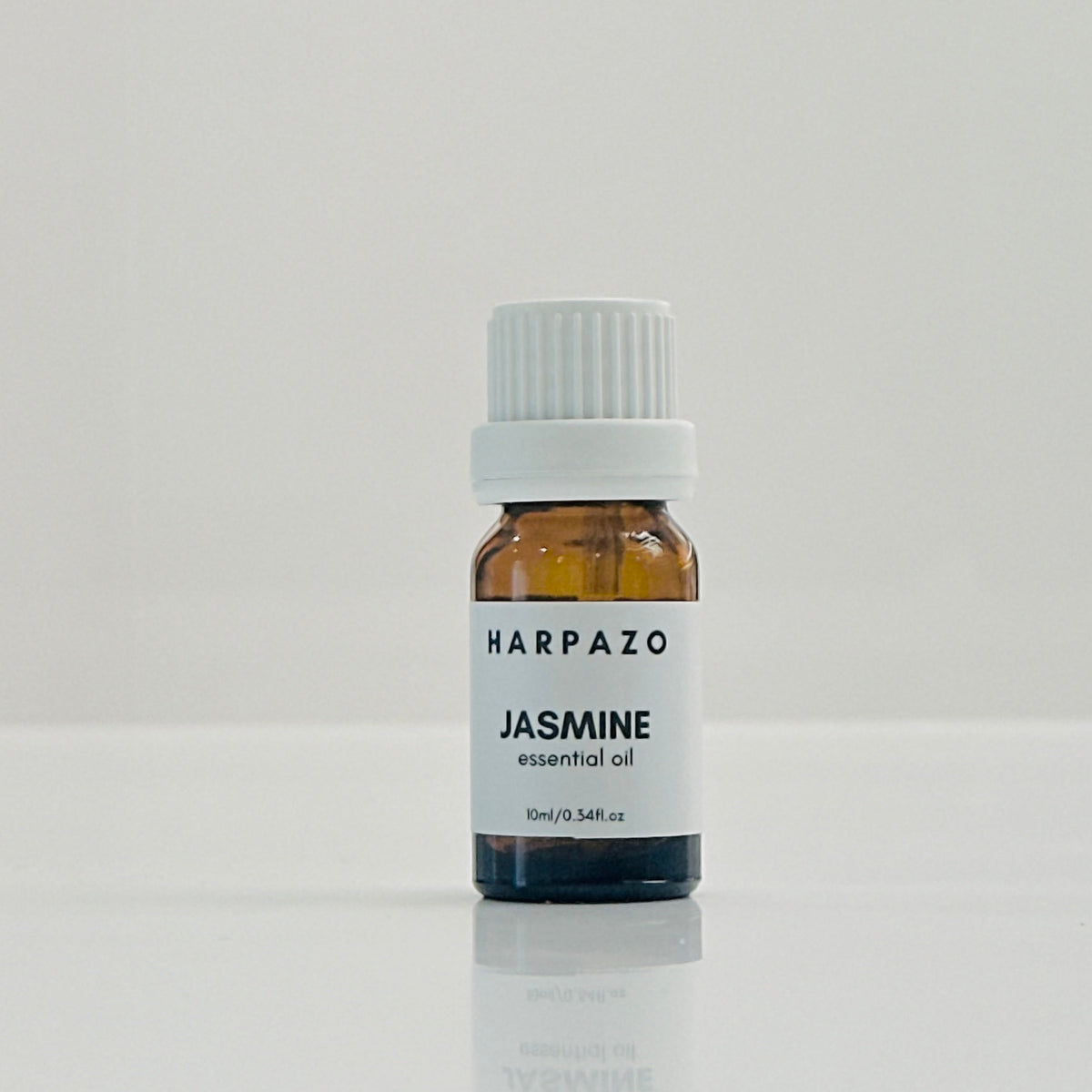 A small bottle labeled 'HARPAZO JASMINE essential oil 10ml' set against a white background.