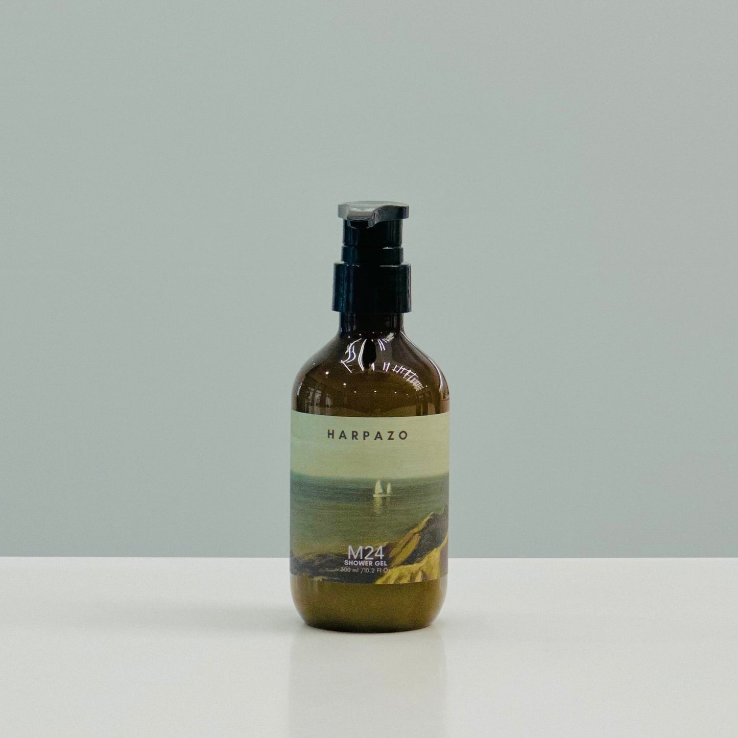 A pump bottle of M24 Longjing Tea shower gel with jasmine and sandalwood, standing against a plain background.