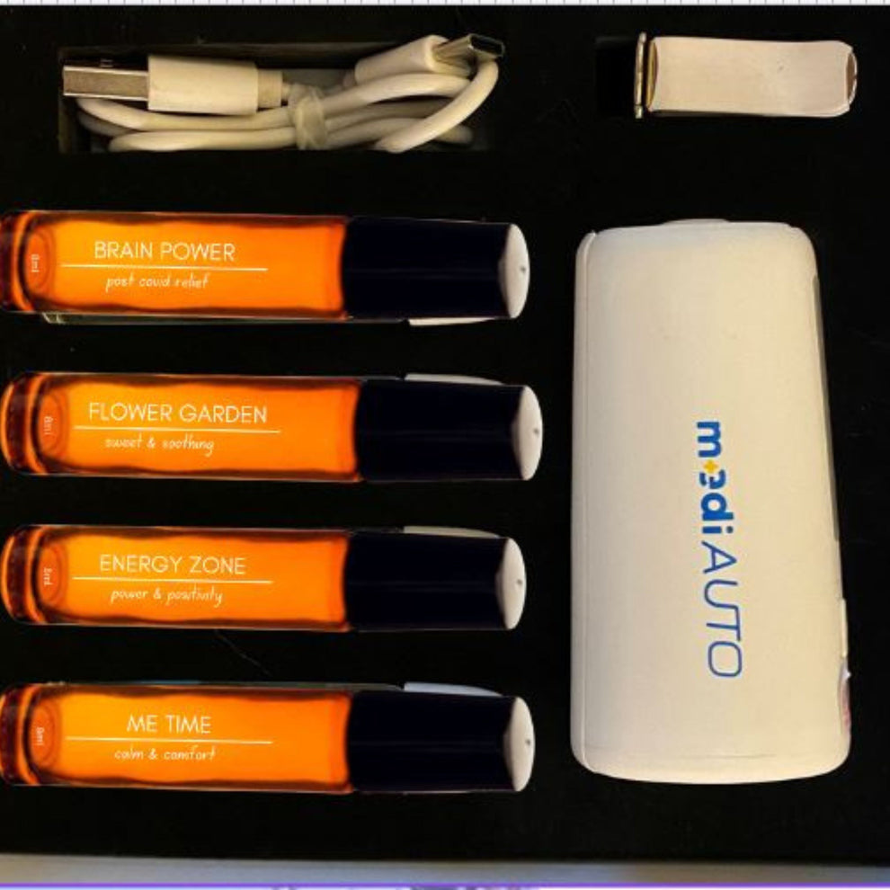 A white aromatic car diffuser with blue light indicators, emitting a cool mist, and displaying the brand name 'MediBlue'.