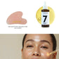 Facial massage set with quartz stone and oil bottle, featuring a woman applying the product.