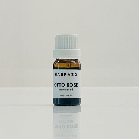 A small bottle labeled 'HARPAZO OTTO ROSE essential oil 10ml' set against a white background.
