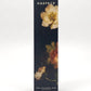 A tall, narrow rectangular product box for Harpazo Oud & Bulgarian Rose, featuring a dark background with classical oil-paint style floral illustrations in cream, red, and green, set against a clean white studio background.