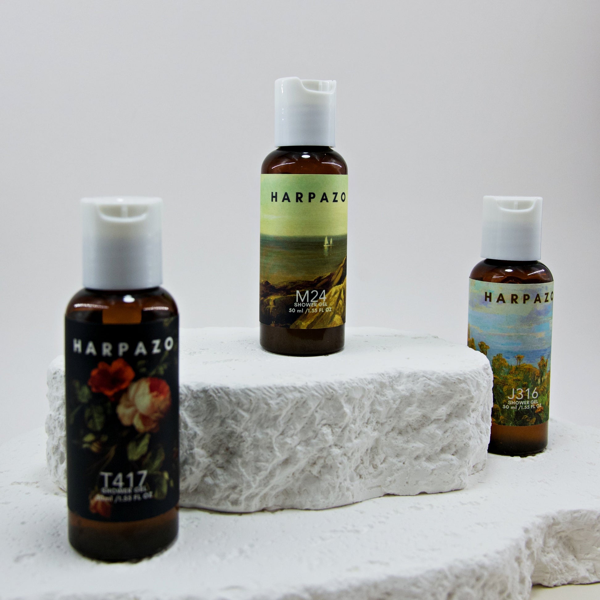 Three bottles of Harpazo skincare products on a white stone surface with a light gray background.