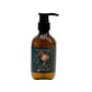 A pump bottle of T417 Moisturizing Shower Gel with a floral design on the label, placed against a neutral background.