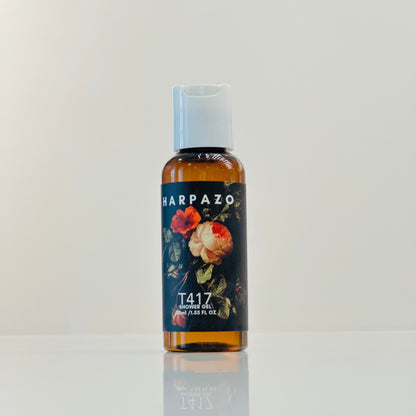 Harpazo T417 toner oil bottle with floral design on a light gray background